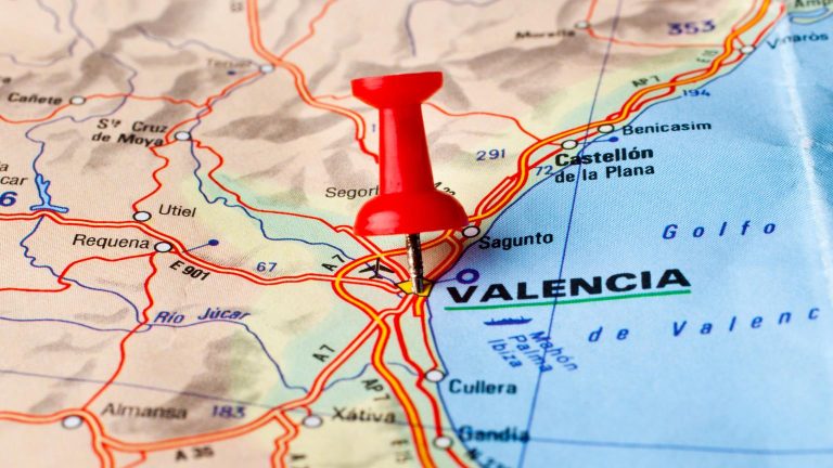 Red pin marking the city of Valencia on a map used to plan cultural excursions and tours.