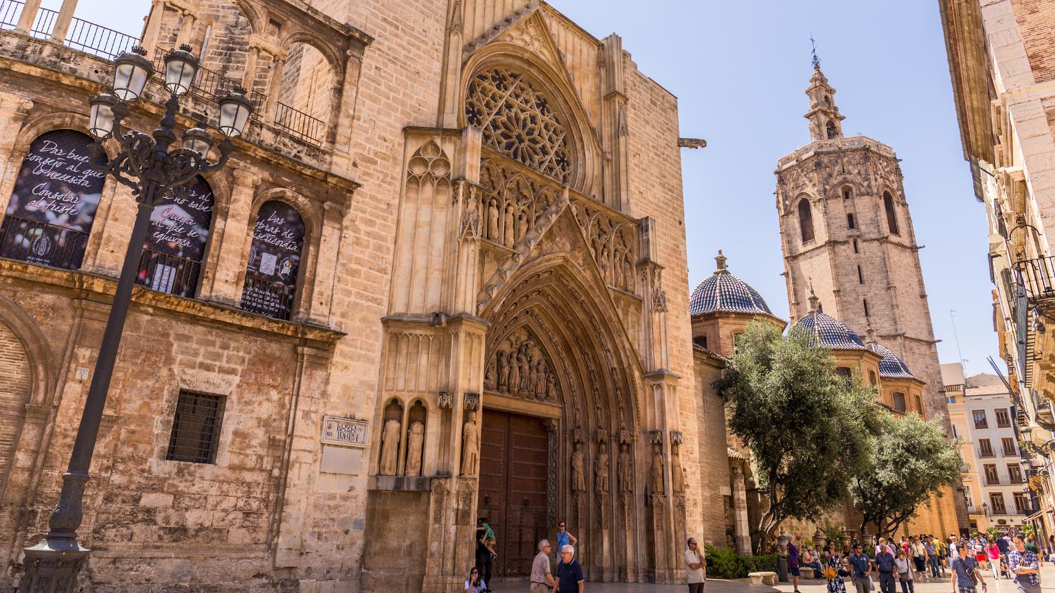 Gothic facade of Valencia Cathedral during guided excursions through the historic center