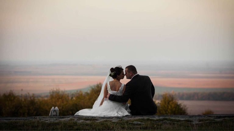 Couple celebrating their symbolic ceremony by the sea after their union, in a unique destination in the world.