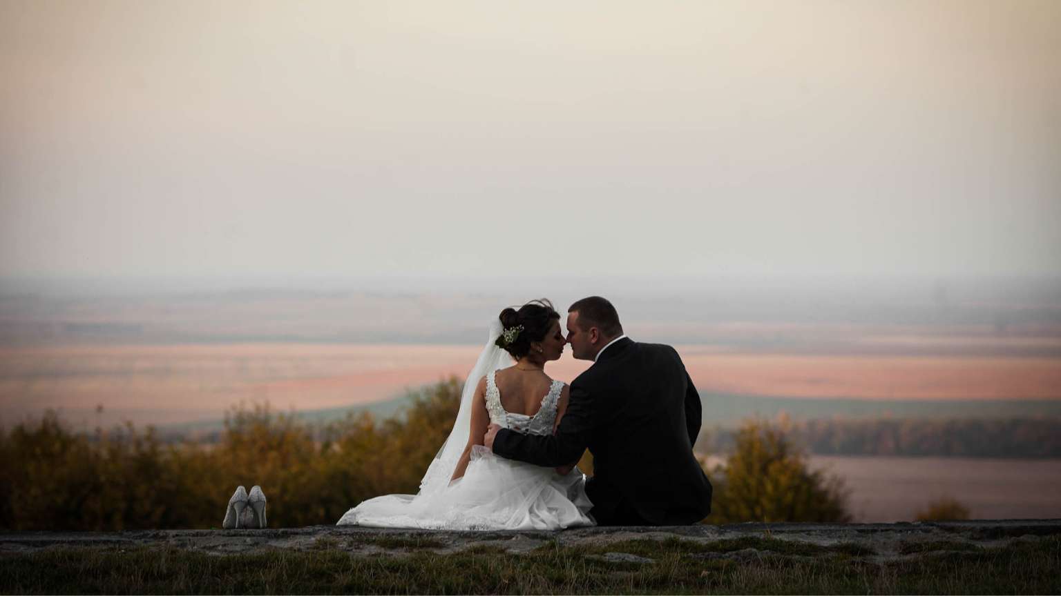 Couple celebrating their symbolic ceremony by the sea after their union, in a unique destination in the world.