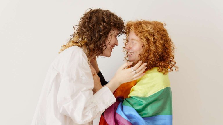 Homosexual couple celebrating their symbolic union in an intimate setting.