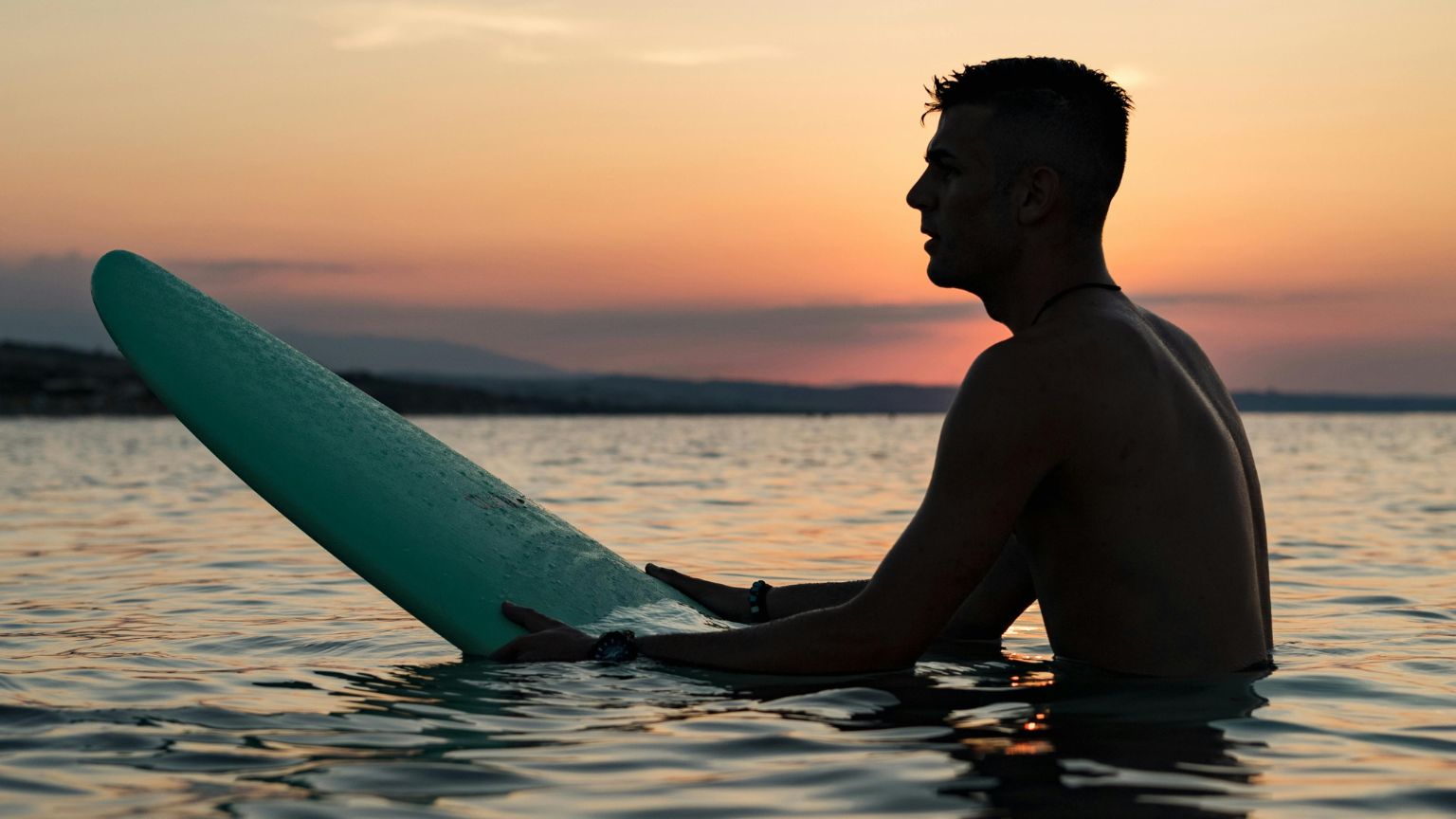 Surfer enjoying clean ocean waves during a surf in Santa Teresa
