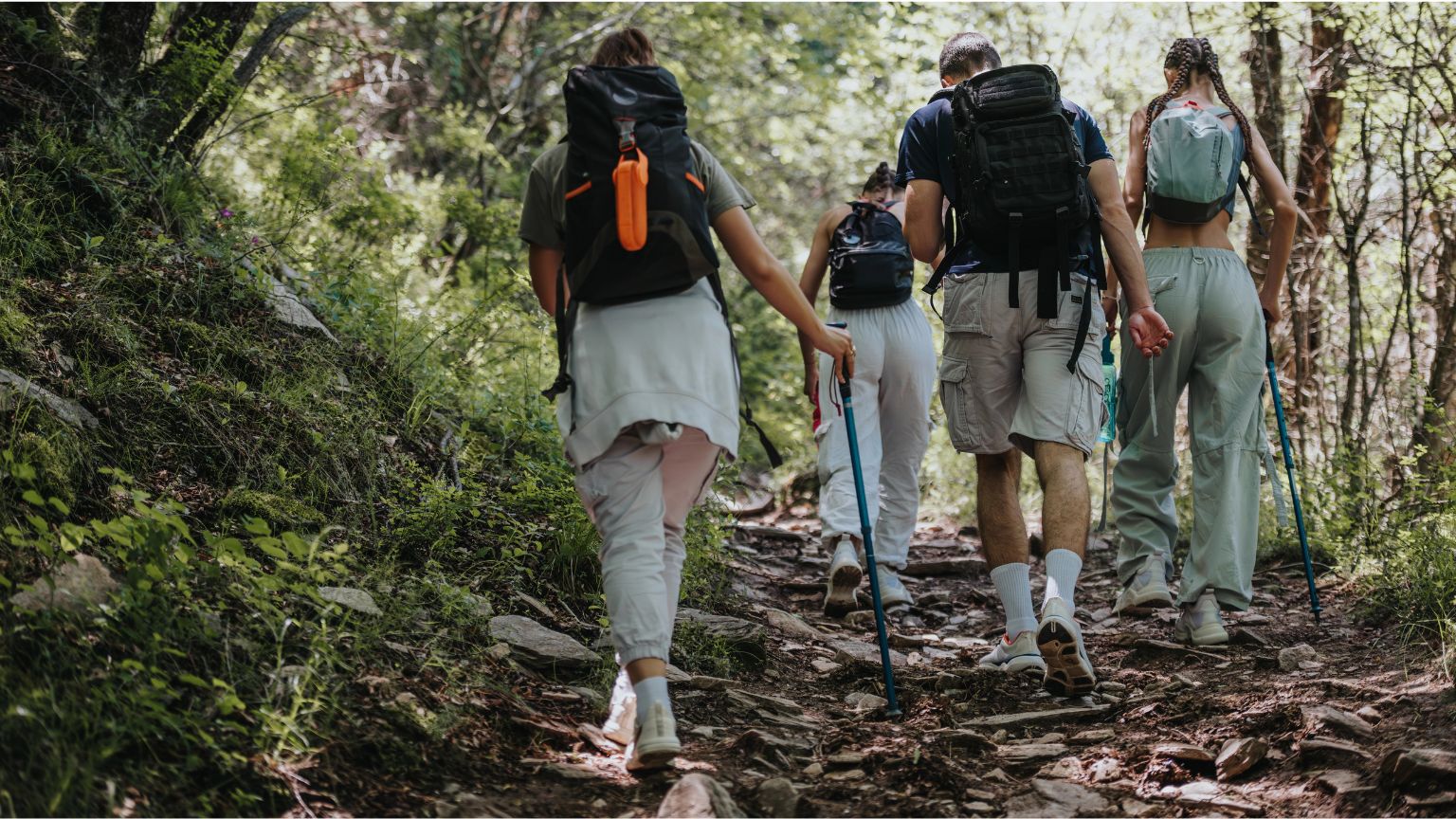 Adventurers canyoning through a wild river in southern Spain on an outdoor adventure trip