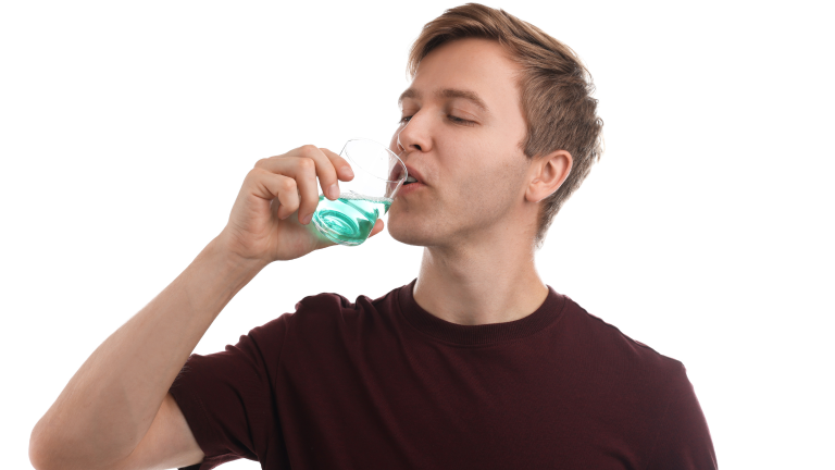 Person brushing their teeth at home, following expert oral hygiene tips
