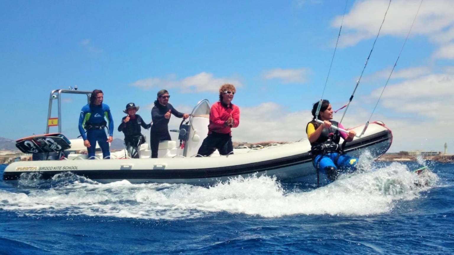 Professional kitesurf lesson in Gran Canaria with instructor supervising student on the water
