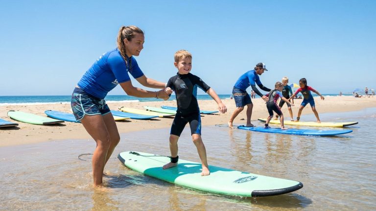 What are surf lessons for kids and the experience of a summer surf camp?